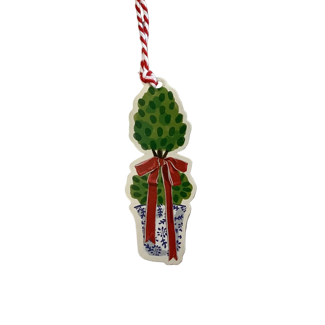 Gift Tag Book topiary die-cut holiday tag in a blue and white patterned pot with red ribbon and baker’s twine.