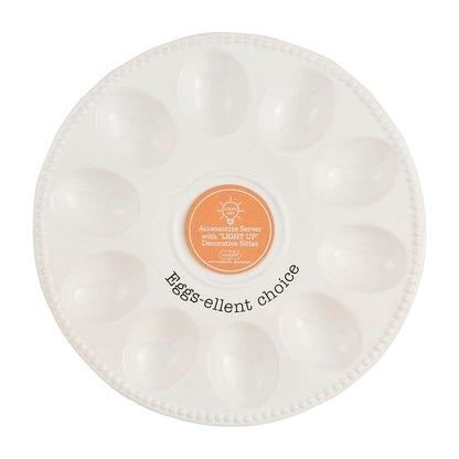The Deviled Egg Tray Light-Up Holder is a white ceramic platter with twelve indentations, an orange label in the center, and "Eggs-ellent Choice" on the edge. Ideal for deviled eggs and a stylish centerpiece. Available size: Standard.