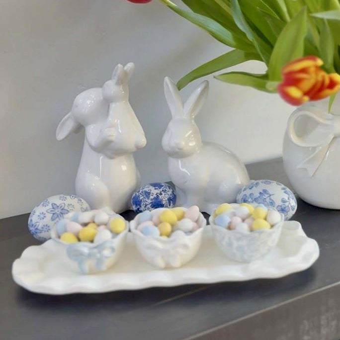 Bow Ramekin Set: small ceramic dishes with hand-painted ruffle rims, available in multiple sizes, shown filled with candy eggs.