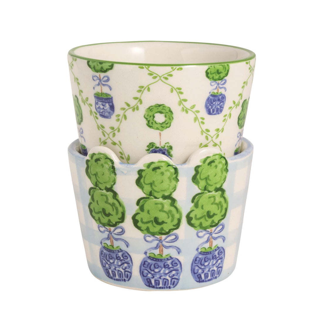 Set of two ceramic ramekins: one white with green topiary trees, one blue checkered; available in small and medium sizes.