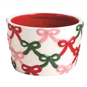 Small white ceramic bowls with red interiors and red, green, and pink bow patterns. Available in 4 styles.