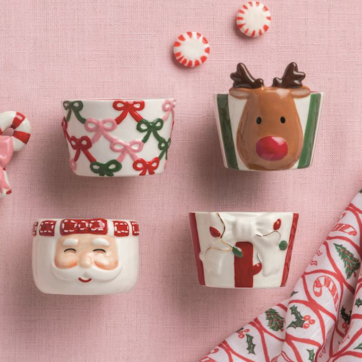 Festive hand-painted ceramic tidbit dishes in four styles: Santa, reindeer, present, and bows. Available sizes: 6″ diameter.