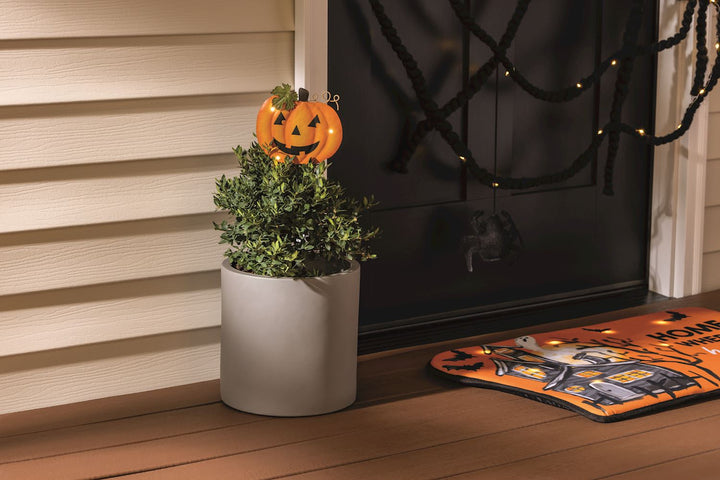 Halloween Light-Up Plant Stakes with jack-o’-lantern design for potted plants; available in small, medium, and large sizes.