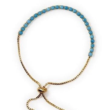 Adjustable tennis bracelet with round turquoise stones, sliding clasp, and chain ends. Available in sizes S, M, and L.