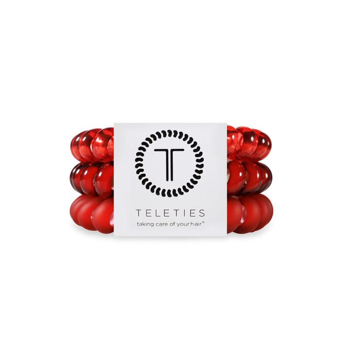 Three shiny red Spiral Hair Coils from Red Carpet Ready, secured by a Teleties label. Available in small and large sizes.