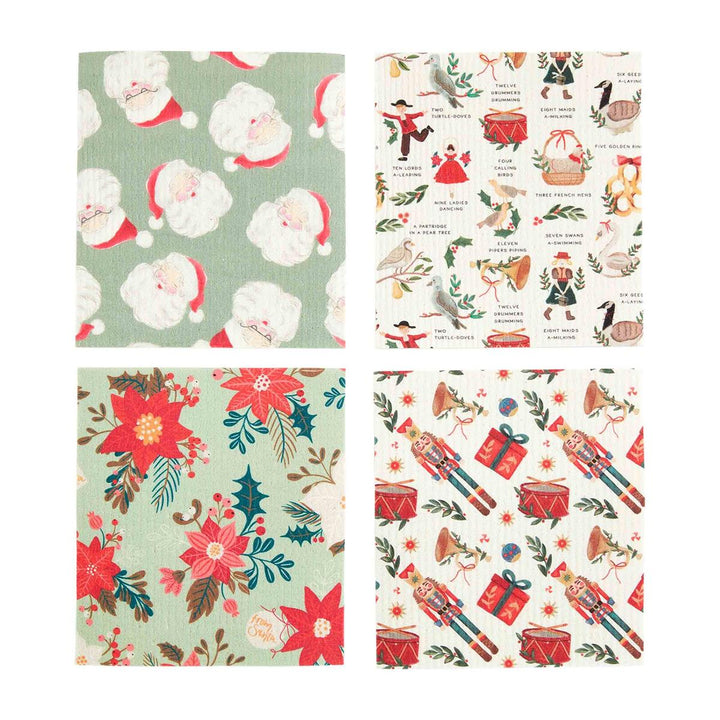 Four Christmas dishcloths featuring patterns of Santa Claus, the Twelve Days of Christmas, poinsettias, and nutcrackers.