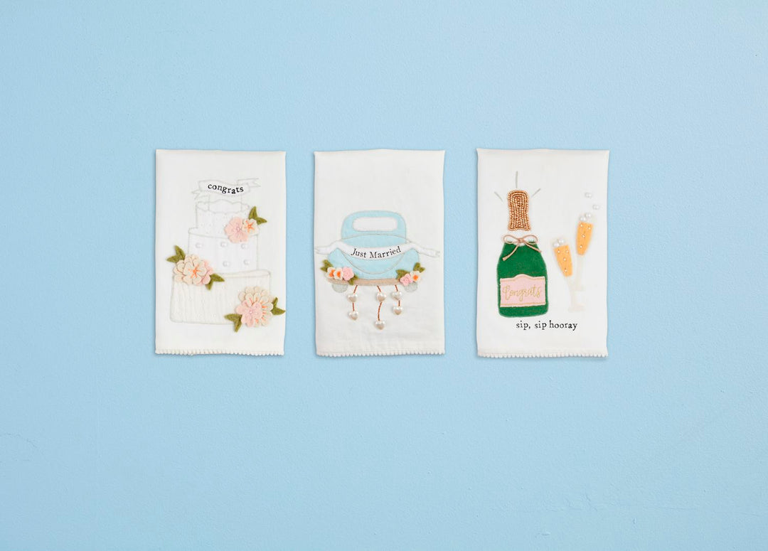 Wedding Beaded Tea Towels in premium cotton featuring: cake with "congrats," car with "just married," and champagne glasses with "sip sip hooray." Available in standard size.