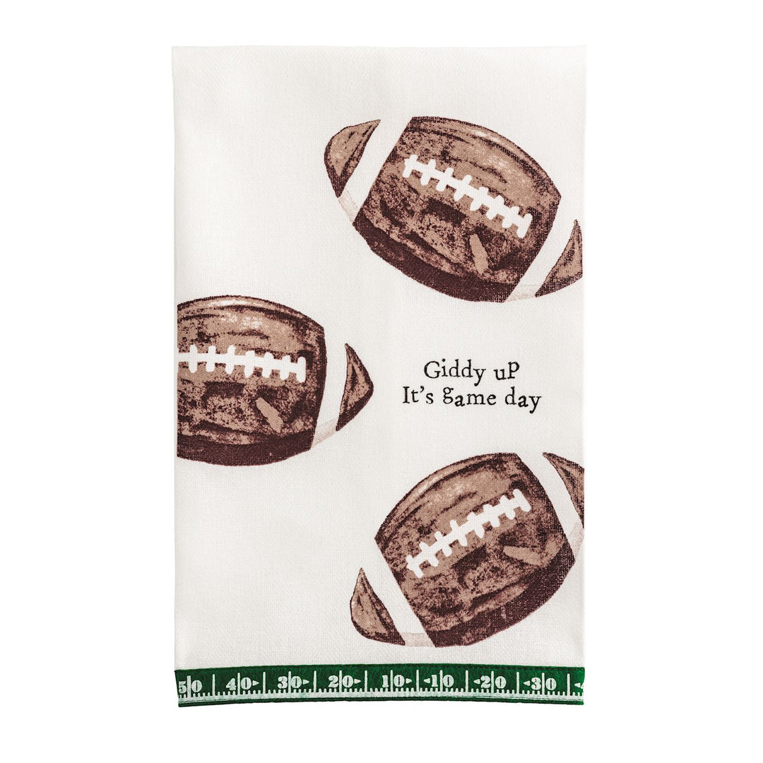 Giddy Up Tailgate Towel with three brown football prints, green ruler-style border, bold black “Giddy up It’s game day” text; available in multiple sizes.