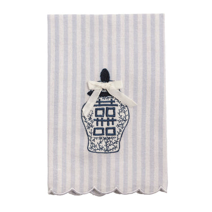 Tea towel with white and light blue stripes, scalloped edges, blue topiary embroidery, cream bow. Available in one size.