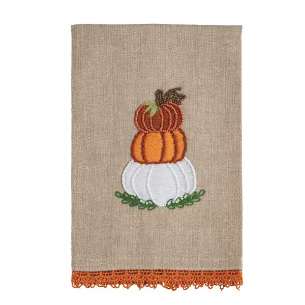 Tan linen towel with orange and white embroidered pumpkins on green leaves, finished with orange lace trim. Available sizes: standard hand towel.