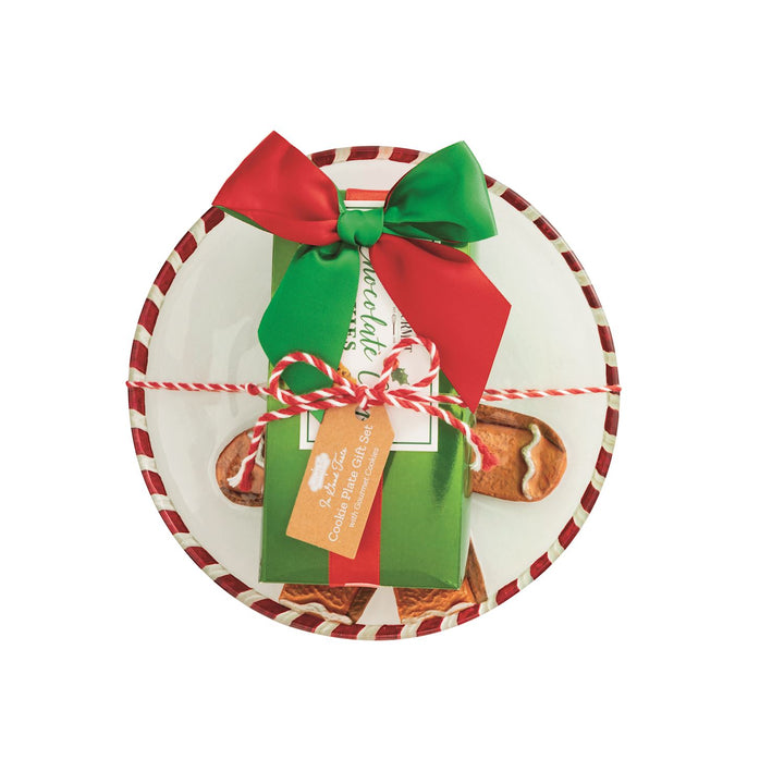 Holiday Gourmet Cookie Plate Set featuring a white plate with a red and white striped rim, topped with a green gift box tied with a red and green bow and a gift tag.
