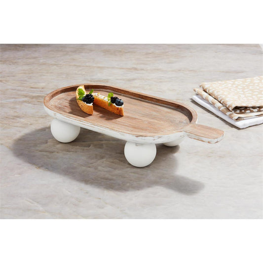 The Bead Footed Paddle Board features a rustic design with a handle, elevated on white ball feet. Sizes available: Small, Medium, Large.