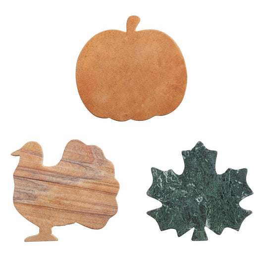 Set of three marble coasters shaped like pumpkin, turkey, and maple leaf in brown and green. Sizes: approx. 4–5 inches each.