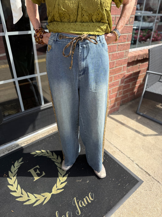 Cheetah Contrast Jeans: relaxed fit, wide-leg blue denim with drawstring waist and rope belt. Available in sizes XS–XL.