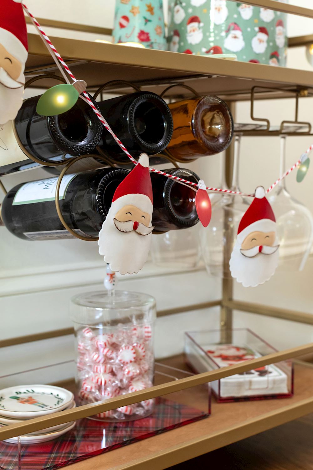 Light-Up Christmas Garlands with Santa Claus face cutouts and colorful LED bulbs on a red and white string.