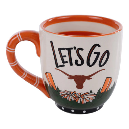 Hand-painted mug with orange handle, "LET'S GO" text, longhorn logo, pom-poms. Sizes: 12oz, 16oz.