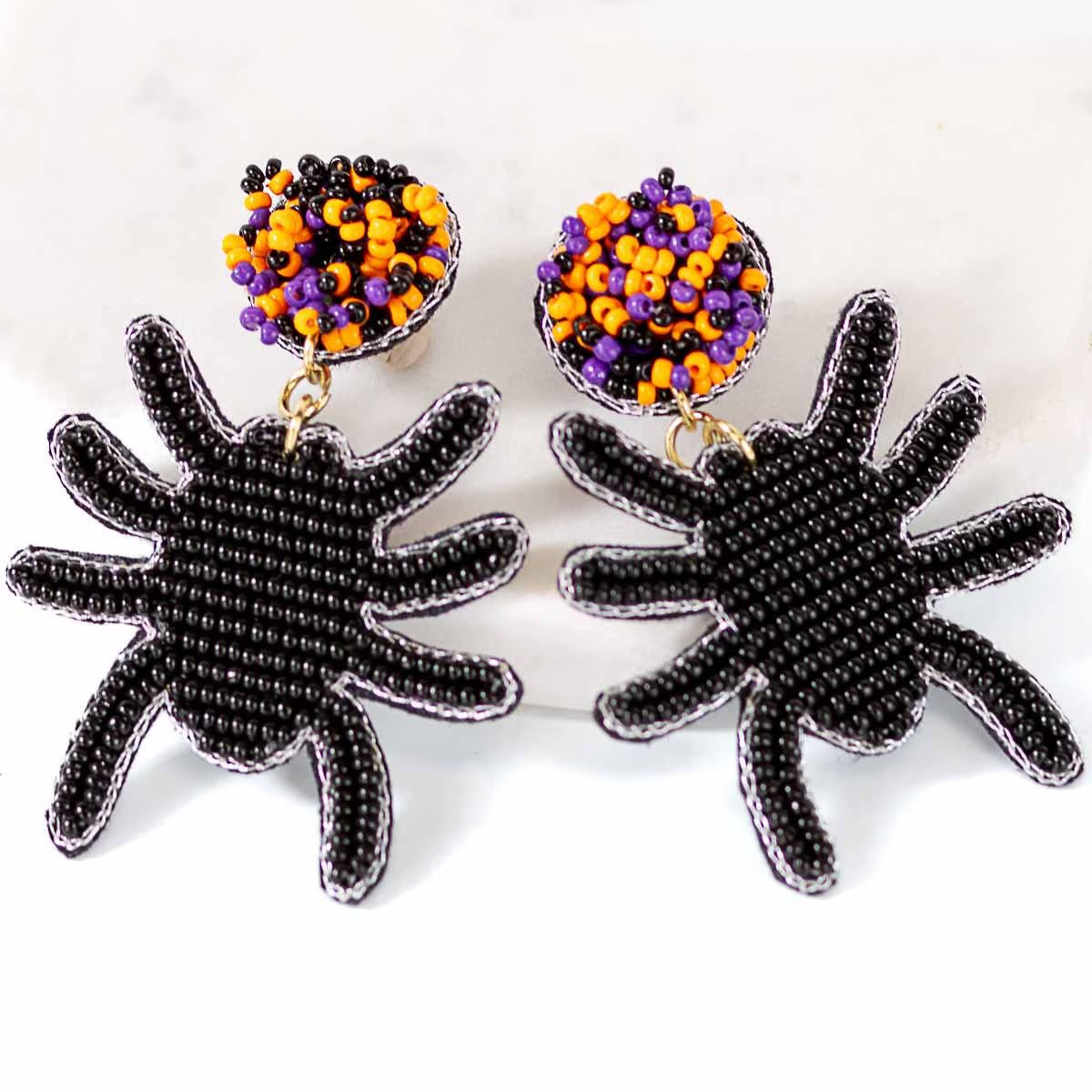 Spooky Spider Beaded Earrings: Black beaded spider shapes with round orange, purple, and black beaded studs. Sizes available: Small, Medium, Large.