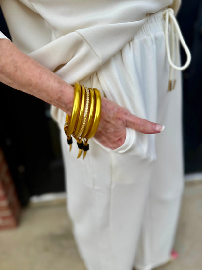 Hazel Ivory Pants in a loose, off-white fit. Available in sizes XS-XL.
