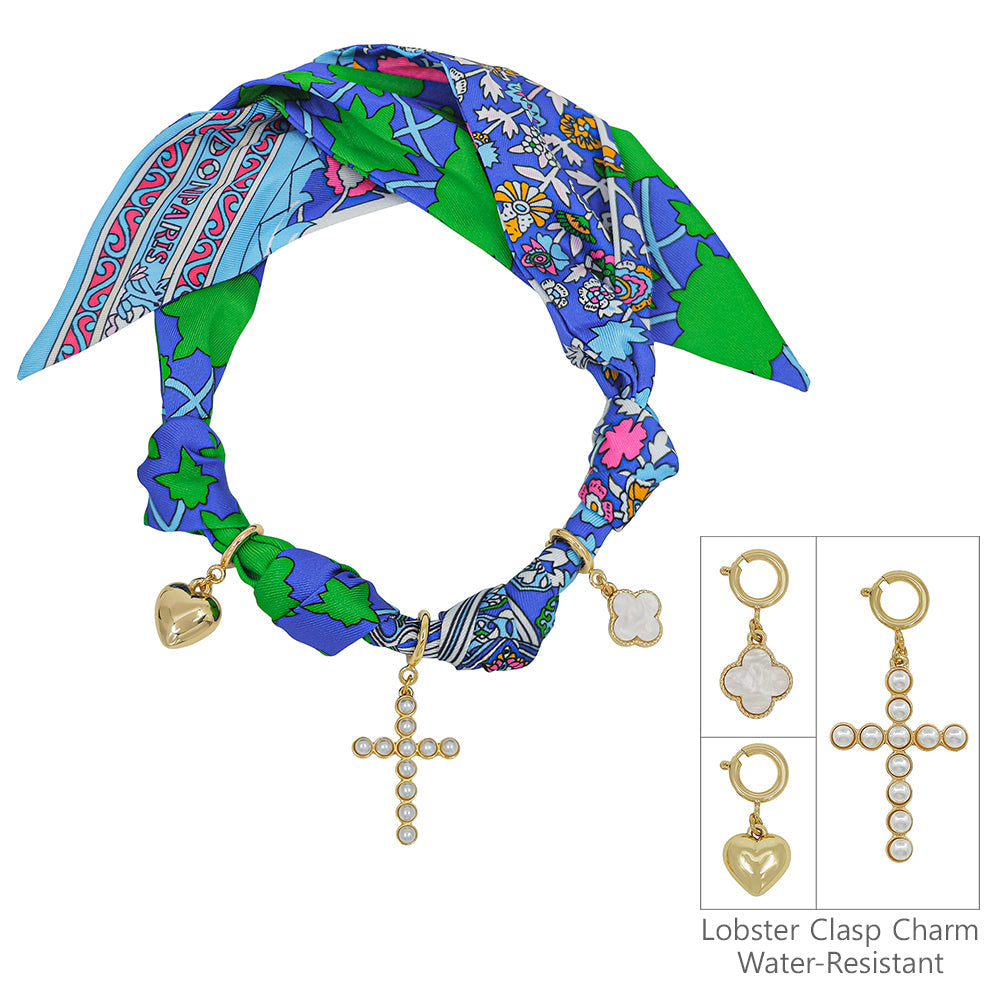 Blue, pink, and green knotted scarf necklace with gold heart, quatrefoil, and pearl cross charms. Water-resistant. Sizes: S/M/L.