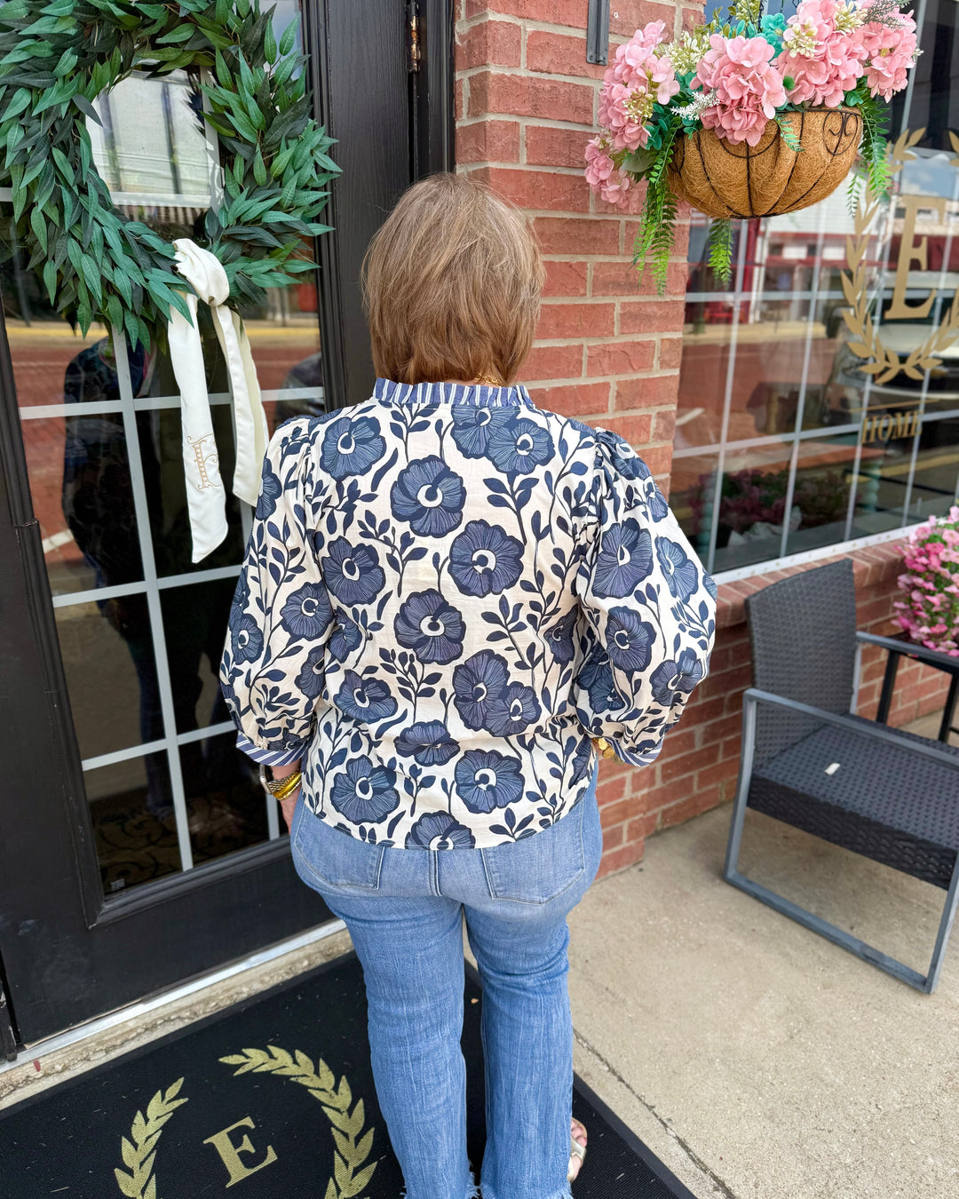 Bonnie Ruffle Floral Blouse featuring delicate ruffles and floral print. Available in XS–XL.