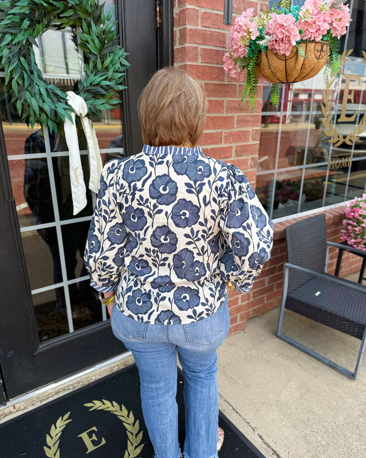 Bonnie Ruffle Floral Blouse featuring delicate ruffles and floral print. Available in XS–XL.