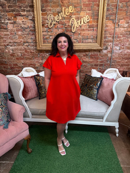 Red Collared Short Sleeve Dress, available in sizes XS–XL. Features button front, tailored fit, mid-thigh length.
