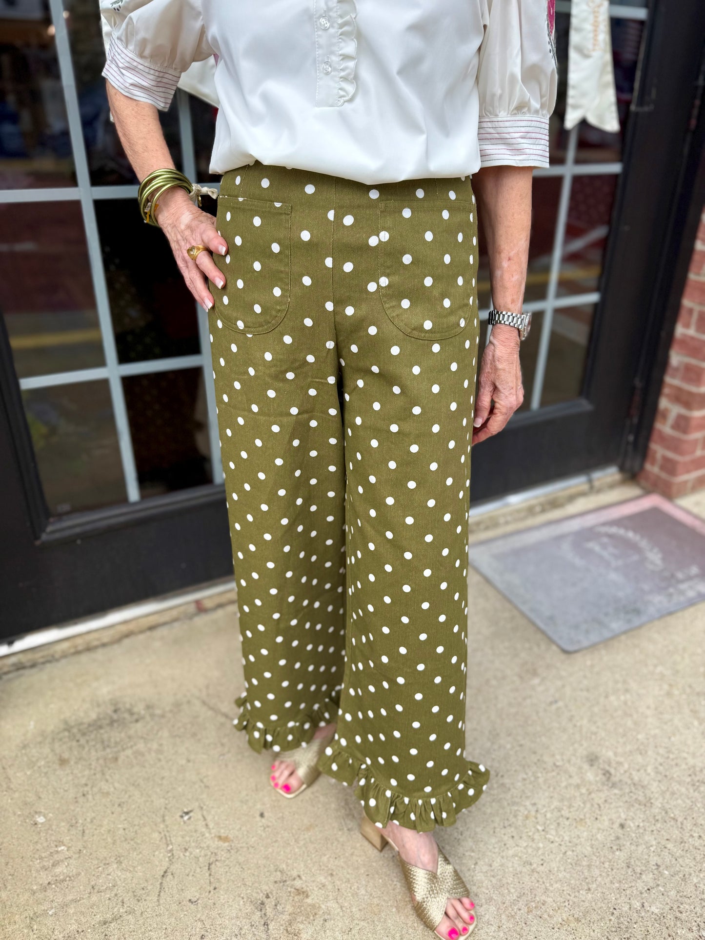Olive Polka Dot Ruffle Hem Pants shown; available in sizes XS-XL.