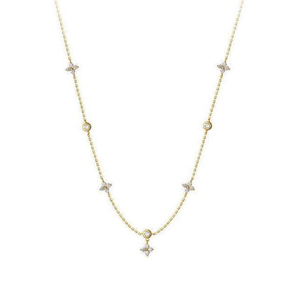 925 sterling silver necklace with four-petal flower charms and small round cubic zirconia. Available in multiple sizes.
