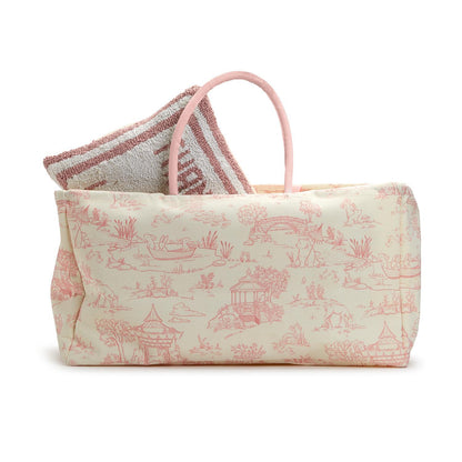 The Animal Toile Hamper/Storage Tote features a cream-colored exterior, pink handles, and a light red pastoral scene pattern. Made of cotton canvas. Ideal for nursery storage.

Sizes available: One size.