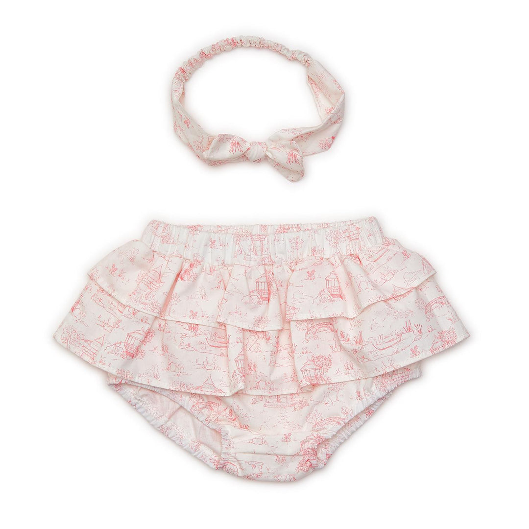 White diaper cover with pink toile animal print and matching bow headband. Available in sizes 0-3M, 3-6M, and 6-12M.