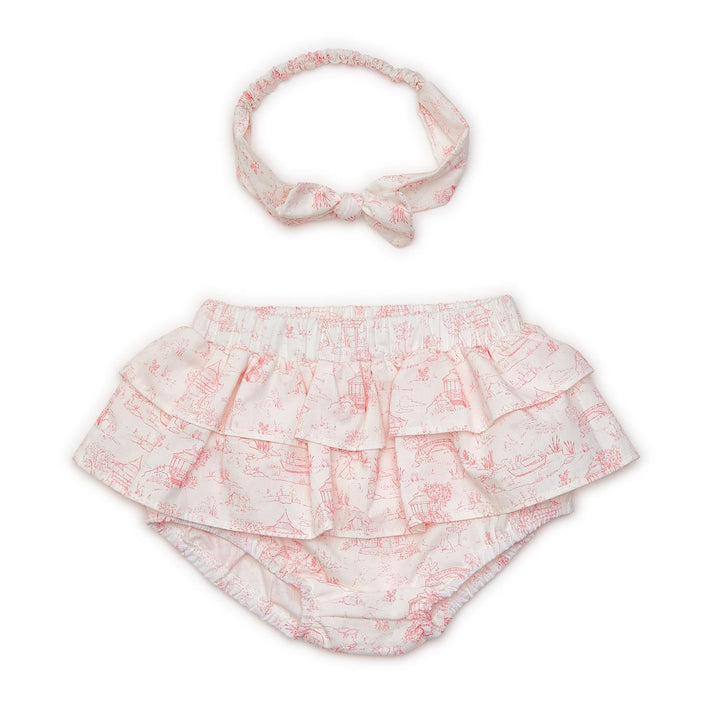 White diaper cover with pink toile animal print and matching bow headband. Available in sizes 0-3M, 3-6M, and 6-12M.