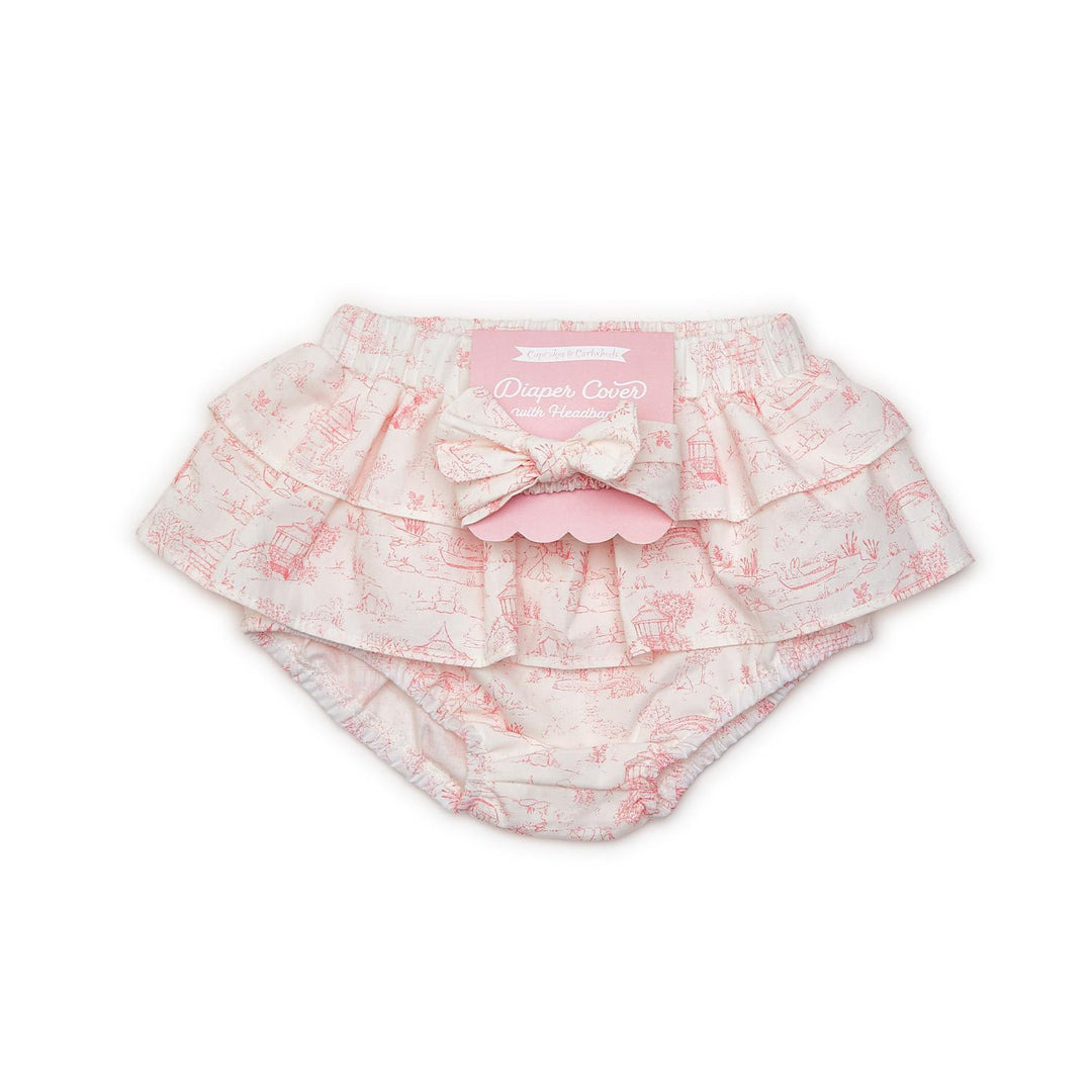 Pink and white cotton ruffled diaper cover with bow and toile pattern, matching headband. Sizes: NB, 0-3M, 3-6M, 6-12M.