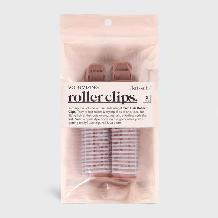 Clear package with two pink Kitsch Volumizing Roller Clips; black label. Available in standard size. For volume and curls.