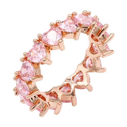 Heart-shaped pink quartz set on rose gold band in an eternity design. Available in size 7.