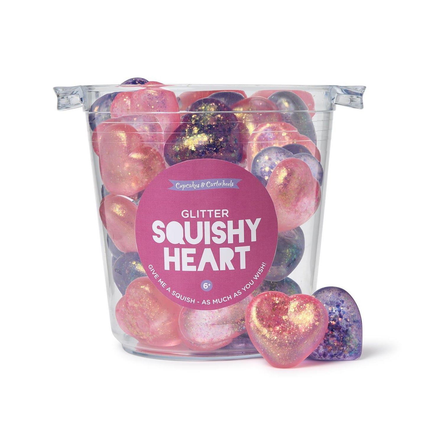 Transparent tub filled with Heart Jellies Glitter Squishy Heart toys in pink and purple, featuring a glittery sparkle. Available sizes: One size only, standard heart dimensions.