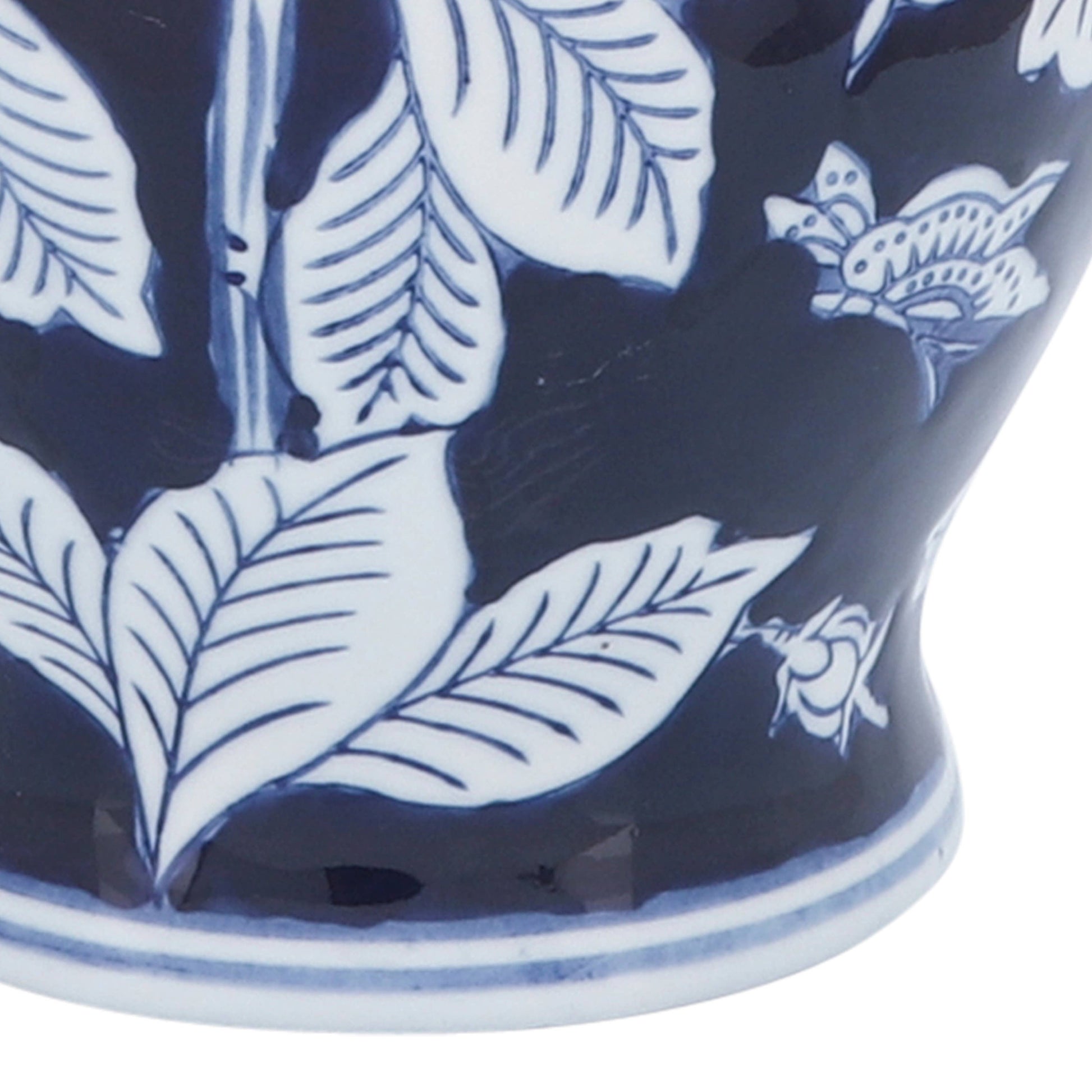 Blue ceramic Chinoiserie vase, 9 in., with white leaf, floral, and butterfly patterns on a dark blue background.