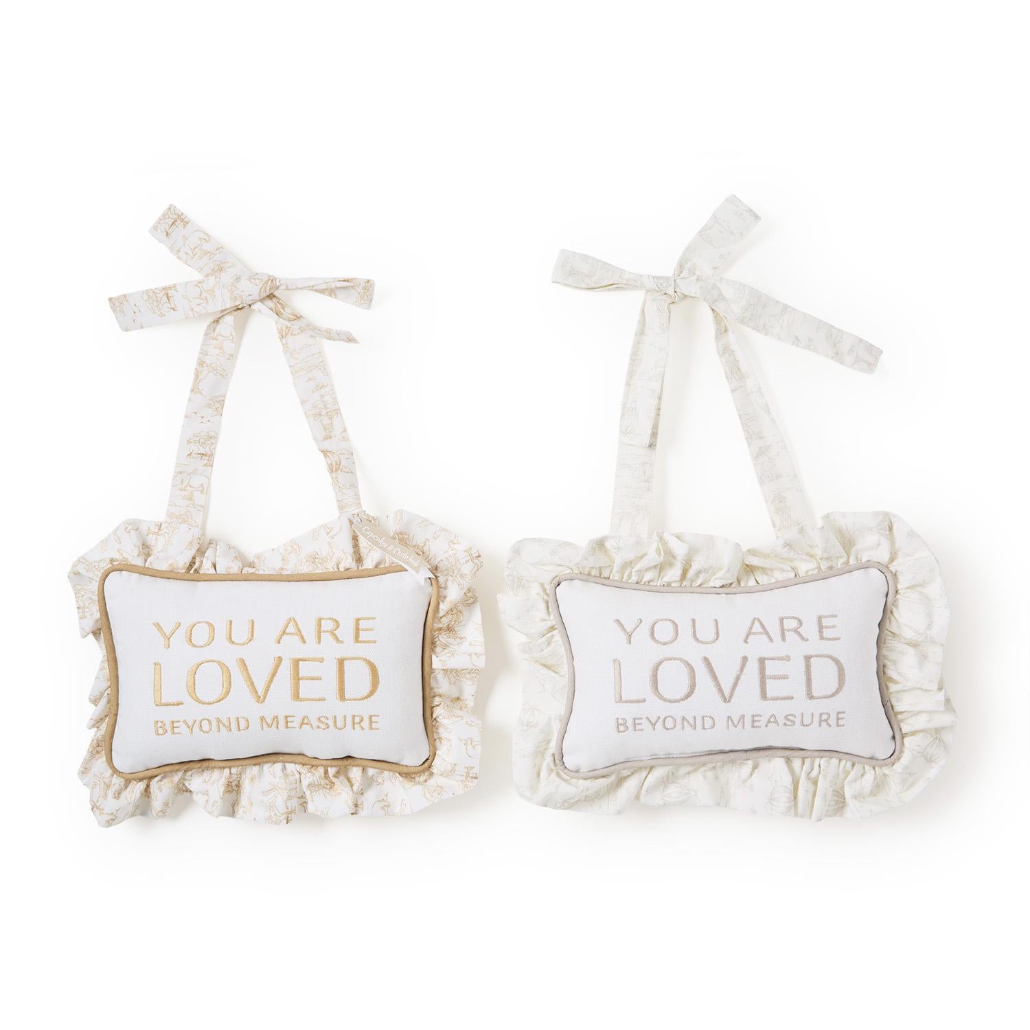 You Are Loved Beyond Measure Door Pillow" in 2 colors, ruffled edges, bows, embroidered text; available in one size.