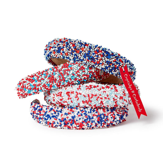 Three headbands with red, white, and blue sprinkles. Available in child and adult sizes. Festive for holidays or events.