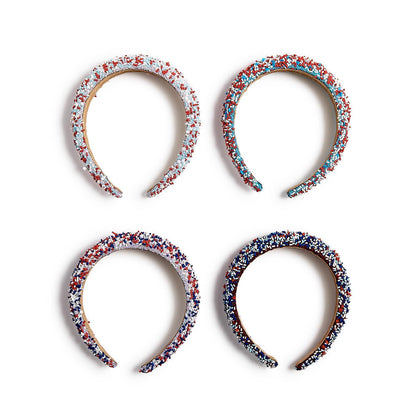 Four Be-You-Tiful Sprinkles Headbands in red, white, blue, and silver with star beads. Available in S, M, L.