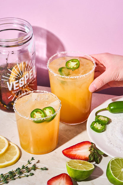 32 oz Craft Cocktail Kit - Jalapeño Margarita shown with two salt-rimmed, jalapeño-garnished glasses.