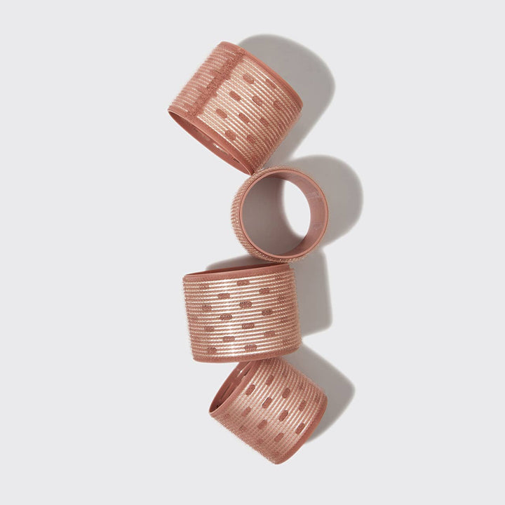 Four terracotta XL Ceramic Thermal Rollers (4pc Set) with textured surfaces for hair volume. Size: XL only.