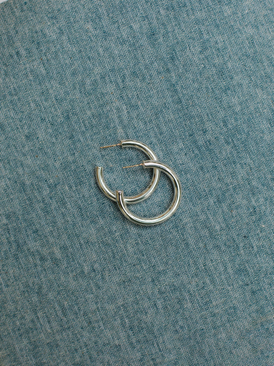 Cameron Silver hoop earrings with surgical steel posts. Available in a small size.