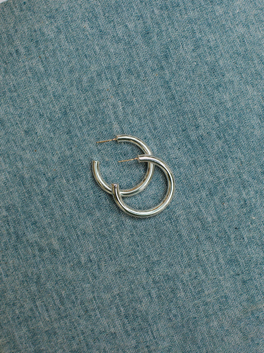 Cameron Silver hoop earrings with surgical steel posts. Available in a small size.