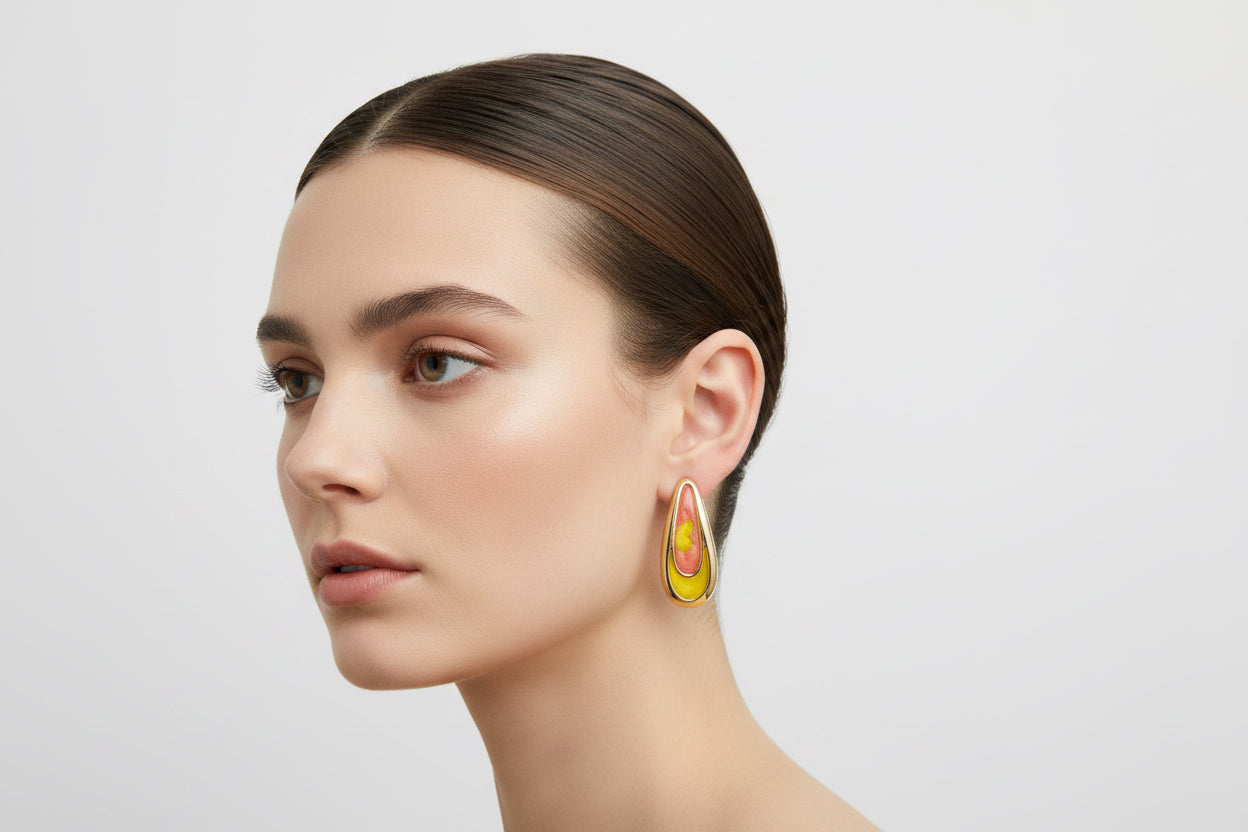 Yellow and pink hoop earrings, available in small, medium, and large sizes.
