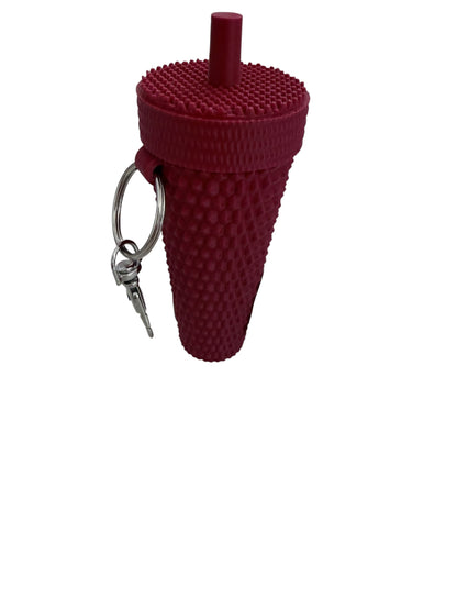 Textured red cup-shaped keychain with lid, straw, and metal keyring. Available in small and large sizes.