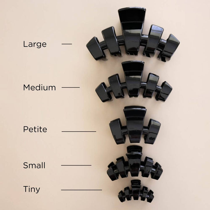 Classic Claw Clip in Jet Black shown in five sizes: Large, Medium, Petite, Small, and Tiny.