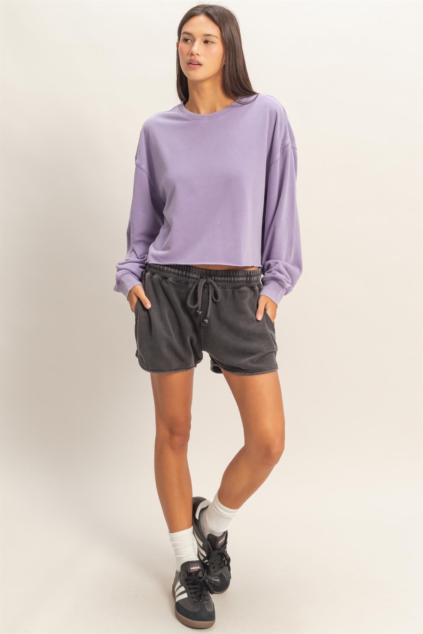 Cropped Mineral Wash Sweatshirt in lavender; available in sizes XS-XL.