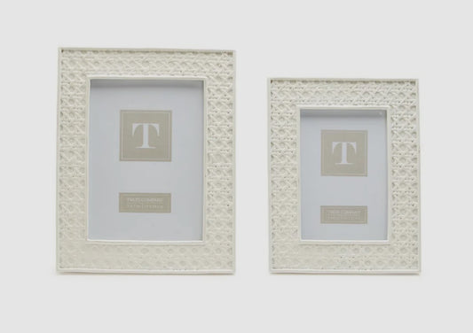 Two White Cane Photo Frames with intricate lattice pattern. Sizes available: Medium and Large. Placeholder text reads "This Company Studio Eleven.