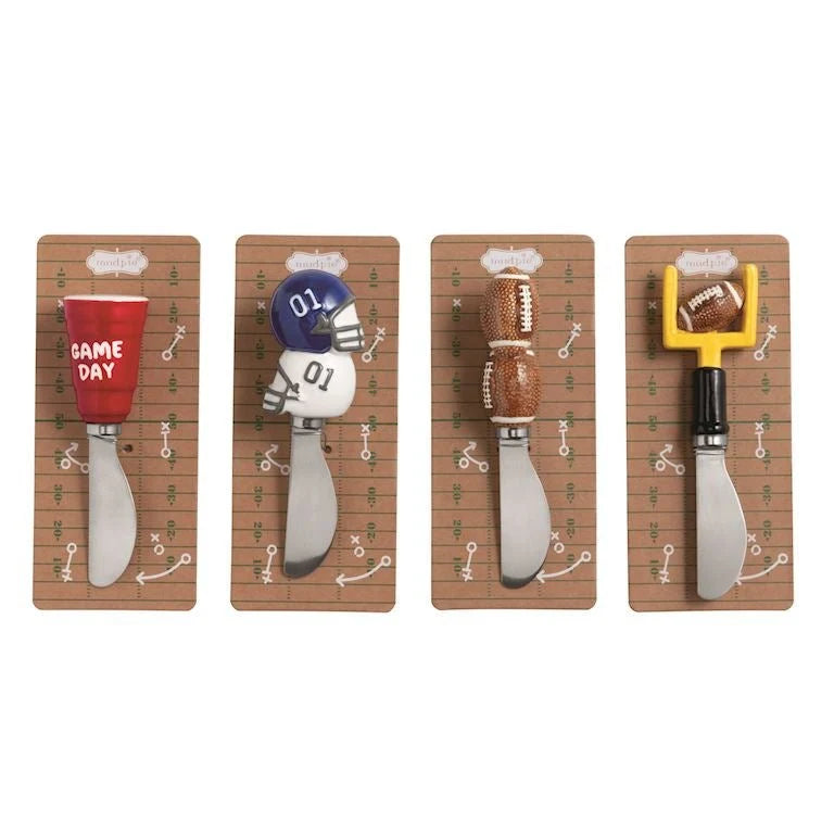 Set of four cheese spreaders with handles shaped as a red cup, football helmet, footballs, and football goalpost. Available in one size.