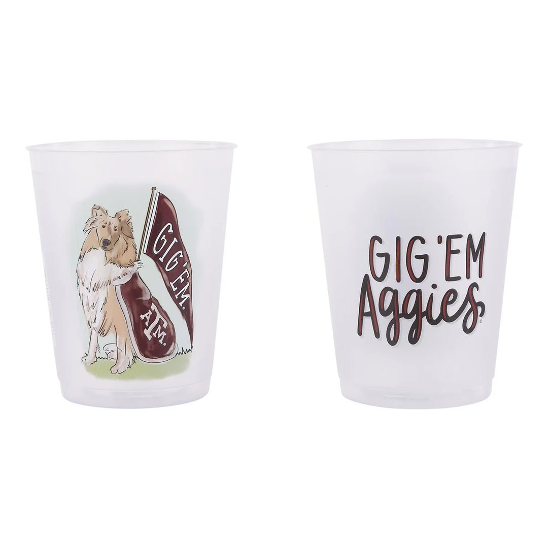 Set of two clear, frosted Texas A&M mascot cups featuring brown text and artwork—one with a dog and "Gig 'Em TAM" banner, the other with "GIG 'EM Aggies." Available in standard drinkware size.